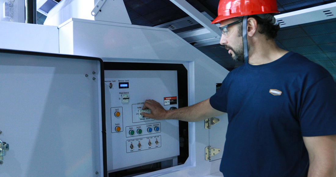 IronWest team member checking a lighting tower control panel