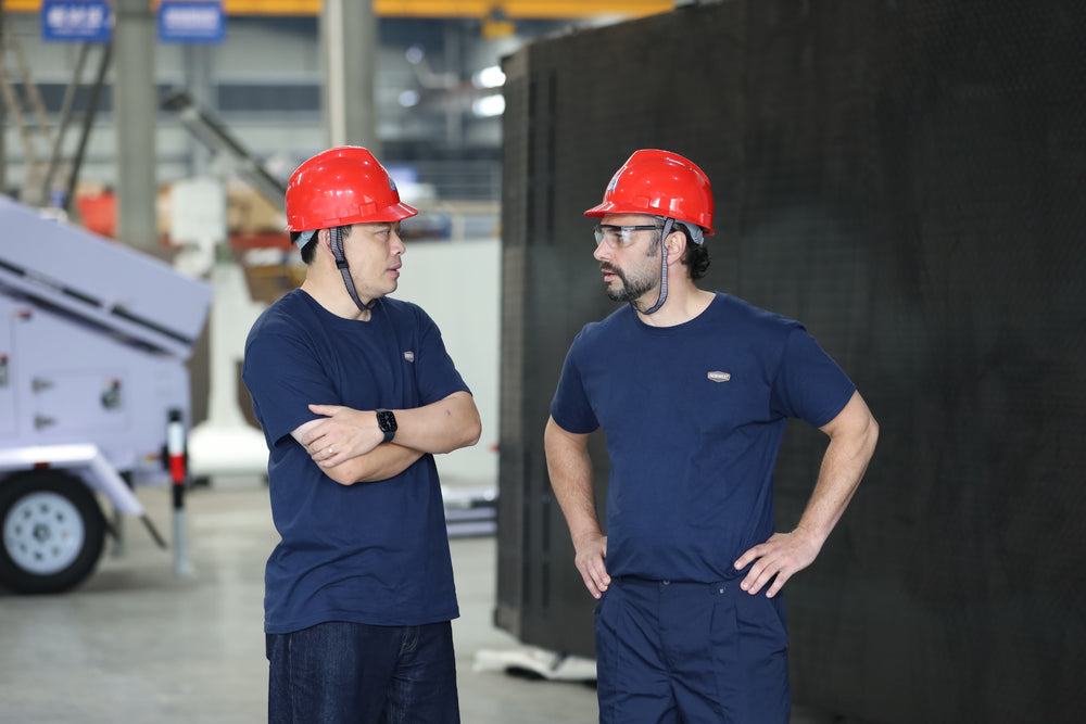 IronWest team members reviewing equipment on the factory floor