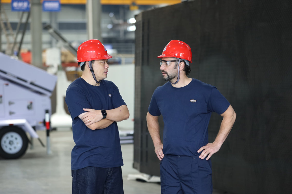 IronWest team members reviewing equipment on the factory floor